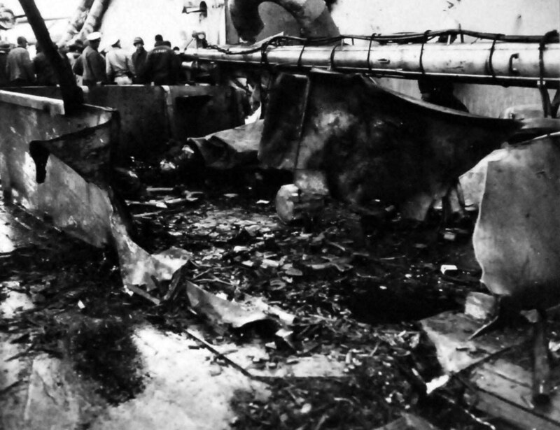 USS Nevada (BB-36) - N3064F.jpg :: USS Nevada (BB-36), Battleship, WW II - US NAVY PHOTO: Damage to  the USS Nevada (BB-36) structure and deck off Okinawa, Ryukyu Islands. Photographed by PHOM2/C J.G. Mull, 27 Mar 1945.