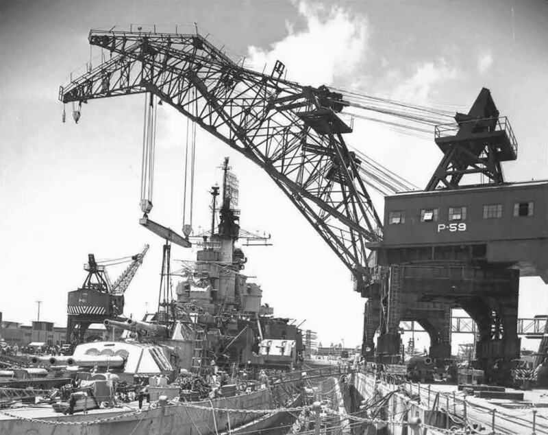 USS Nevada (BB-36) - N3064J.jpg :: USS Nevada (BB-36), Battleship, WW II - US NAVY PHOTO: USS Nevada (BB-36) in drydock May 1945 at Pearl Harbor Naval Ship Yard. Having repairs to the damage caused by the kamikaze attack at Okinawa. Turret number three is being regunned also.