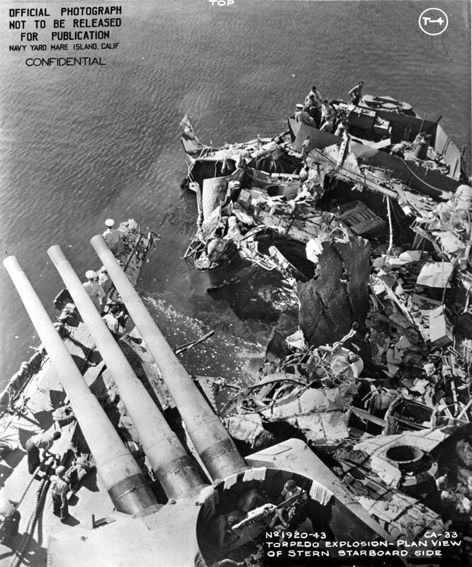 USS Portland (CA-33) - N1744B.jpg :: USS Portland (CA-33), Heavy Cruiser, WW II - US NAVY PHOTO: Overhead view of the fantail while anchored at Tulagi. The damage visible was sustained on 13 Nov 1942. USS Portland (CA-33) took a torpedo hit at 0158 on the starboard quarter, which blew off both inboard propellers, jammed the rudder five degrees right, and jammed number three turret in train and elevation.