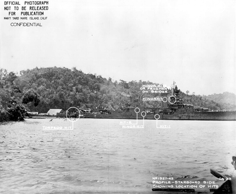 USS Portland (CA-33) - N1744E.jpg :: USS Portland (CA-33), Heavy Cruiser, WW II - US NAVY PHOTO: Starboard side view while anchored at Tulagi. The damage visible was sustained on 13 Nov 1942. USS Portland (CA-33) took a torpedo hit at 0158 on the starboard quarter, which blew off both inboard propellers, jammed the rudder five degrees right, and jammed number three turret in train and elevation.