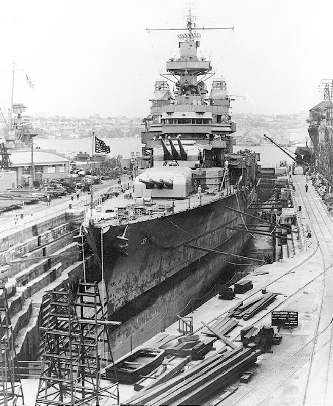 USS Portland (CA-33) - N1744H.jpg :: USS Portland (CA-33), Heavy Cruiser, WW II - US NAVY PHOTO: USS Portland (CA 33) in the Cockatoo Drydock, Sydney, New South Wales, Australia, circa late 1942, while under repair for torpedo damage received in the Naval Battle of Guadalcanal on 13 Nov 1942. Note the arrangement of gun directors on her forward superstructure: main battery director atop the foremast, with FC fire control radar; and a secondary battery director, with FD fire control radar, on each bridge wing. Also note this ship's external degaussing cables, mounted on her hull sides. 