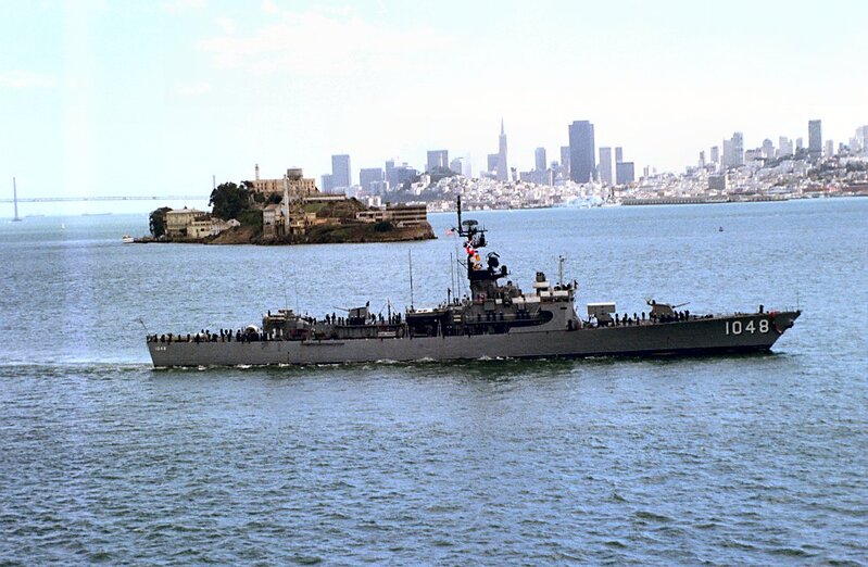USS Sample (DE-1048) - N27022H.jpg :: USS Sample (DE-1048), Destroyer Escort, Vietnam War - US NAVY PHOTO: 1 Oct 1981: San Francisco Bay, Cal. - A starboard beam view of the USS Sample (FF-1048) underway during Fleet Week activities. Visible in the background are the San Francisco-Oakland Bay Bridge, Alcatraz Island, and the San Francisco skyline.