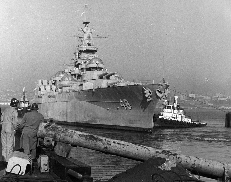USS West Virginia (BB-48) - N3184J.jpg :: USS West Virginia (BB-48), Battleship, Vietnam War - US NAVY PHOTO: USS West Virginia (BB-48) being towed away to be scrapped, 1 Mar 1959.