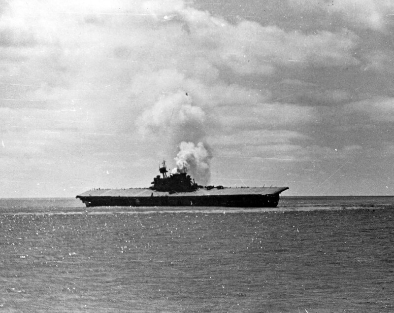 USS Yorktown (CV-5) - N225J.jpg :: USS Yorktown (CV-5), Aircraft Carrier, WW II - US NAVY PHOTO: USS Yorktown (CV-5) sinking after she had been hit by Japanese dive bombers using Type 91 aerial torpedoes, shortly after noon on 4 Jun 1942. Some crew members can still be seen standing high on the port starboard, waiting to abandon ship.