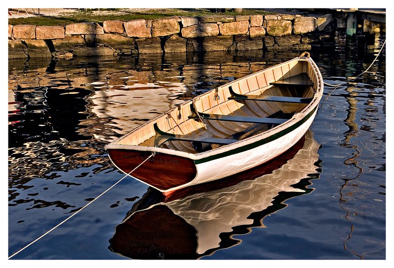 classic wooden boat.jpg :: Mystic - A classic rowboat is reflected in the calm Mystic River.