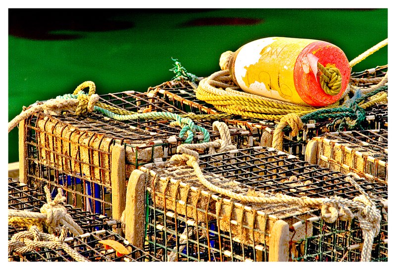 lobster pots-rope.jpg :: Stonington - Lobster pots and a colorful buoy on the town dock.