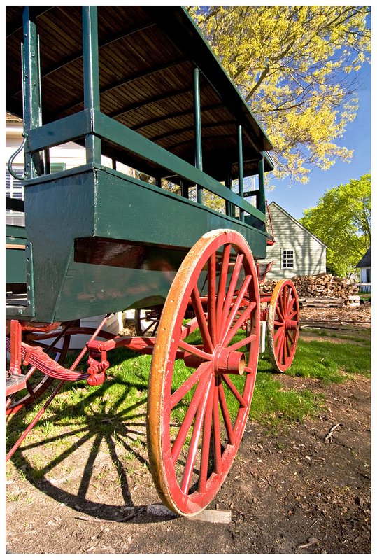 red-wagon-wheel.jpg :: Mystic .. Warm April sun shines on an old wagon at the Mystic Seaport.