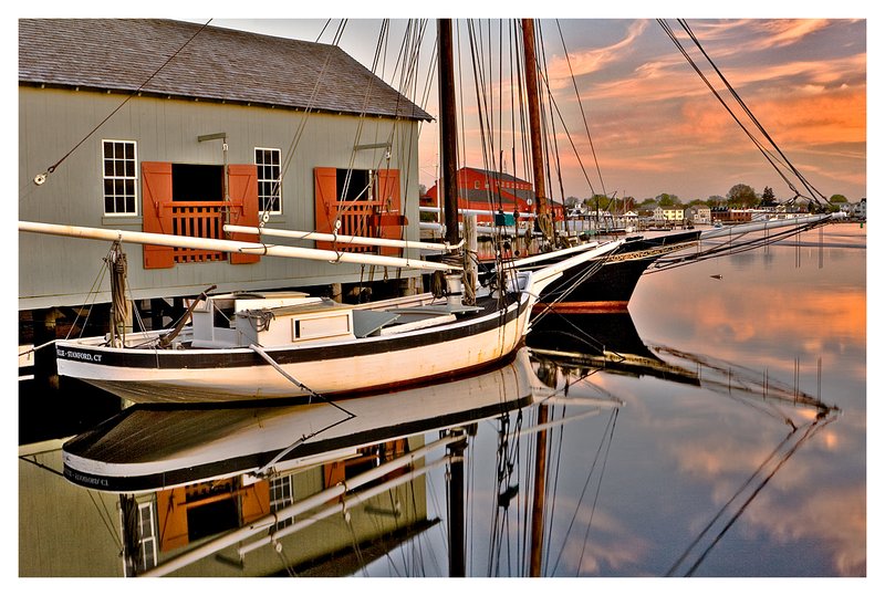 wooden boats and Mystic River.jpg :: Mystic Seaport - Watercraft of the Seaport reflected in the calm Mystic River.