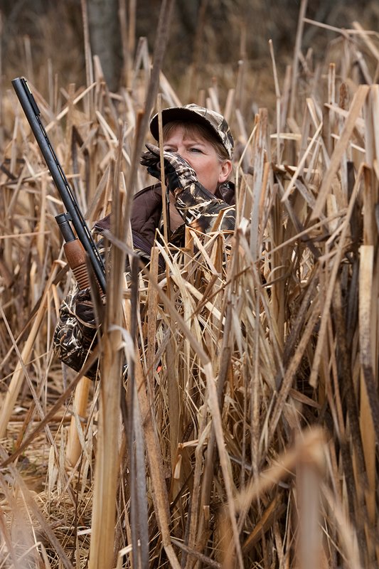 TC-Hunt-Women Waterfowl-D90081-00143.jpg :: Women Waterfowl Hunters in cattails, with black lab dog.
