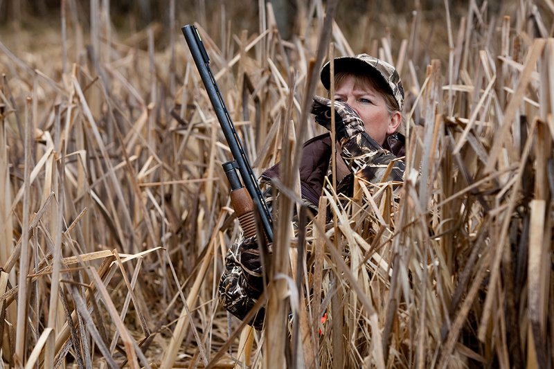 TC-Hunt-Women Waterfowl-D90081-00148.jpg :: Women Waterfowl Hunters in cattails, with black lab dog.