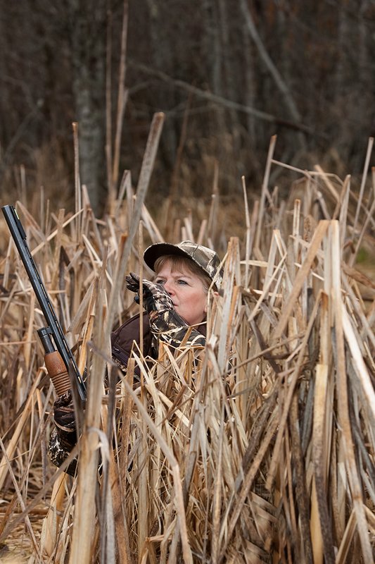 TC-Hunt-Women Waterfowl-D90081-00152.jpg :: Women Waterfowl Hunters in cattails, with black lab dog.