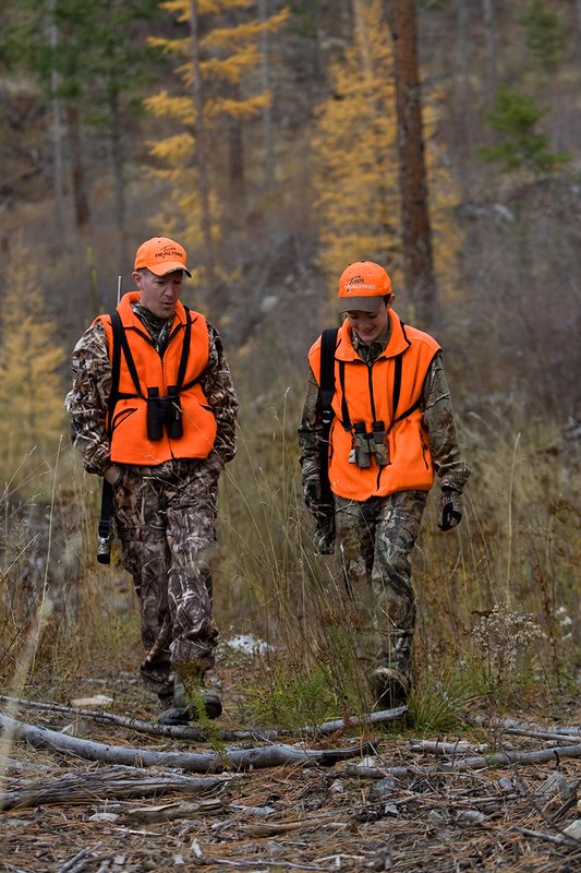 TC-Hunter Parent Child-D89995-00450.jpg :: Father (Jeff Christie) walks with his son Jon up an old two track while going to a deer stand on Jon's first deer hunt.