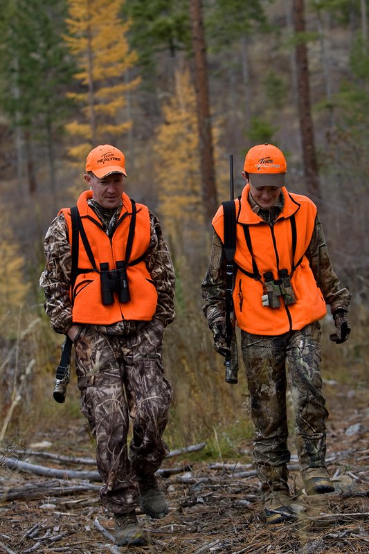 TC-Hunter Parent Child-D89995-00452.jpg :: Father (Jeff Christie) walks with his son Jon up an old two track while going to a deer stand on Jon's first deer hunt.