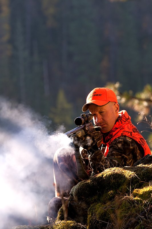 TC-Muzzleloader Hunters-D90008-00357.jpg :: Muzzleloader hunter wearing Advantage Max4-HD camo and Realtree Orange Vest shooting CVA Muzzleloader topped with Leuopold Omega Scope