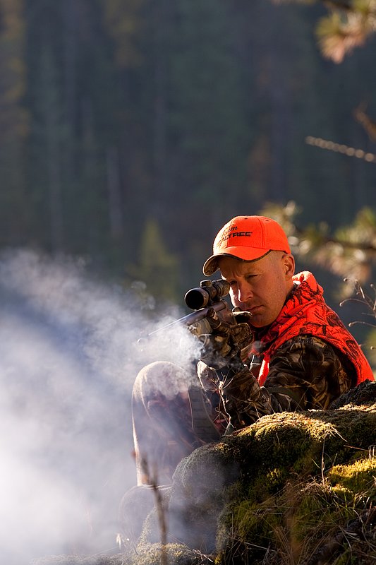 TC-Muzzleloader Hunters-D90008-00359.jpg :: Muzzleloader hunter wearing Advantage Max4-HD camo and Realtree Orange Vest shooting CVA Muzzleloader topped with Leuopold Omega Scope