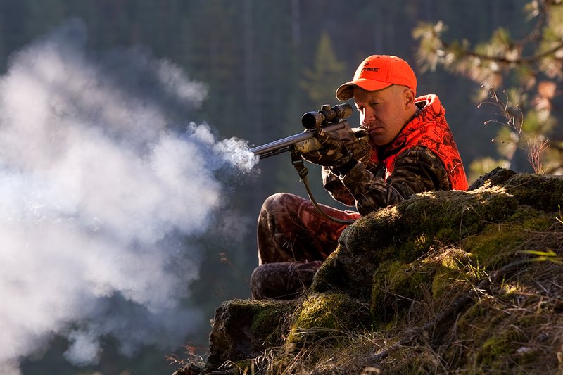 TC-Muzzleloader Hunters-D90008-00362.jpg :: Muzzleloader hunter wearing Advantage Max4-HD camo and Realtree Orange Vest shooting CVA Muzzleloader topped with Leuopold Omega Scope