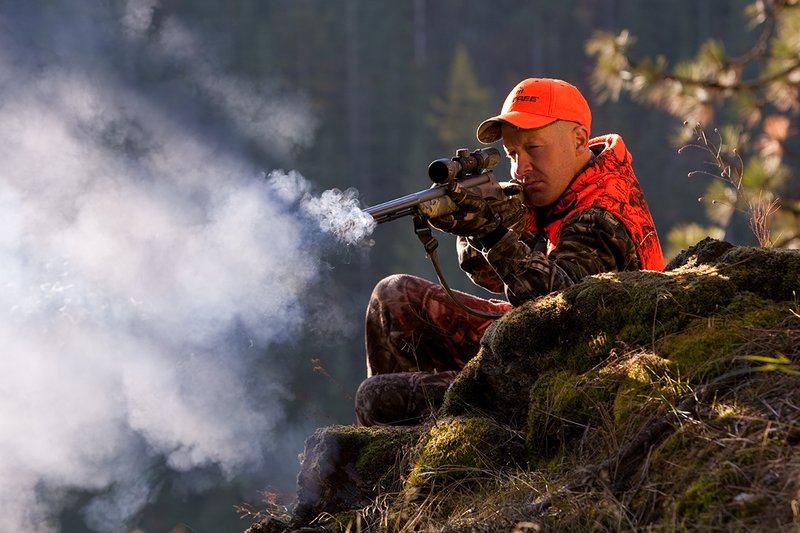 TC-Muzzleloader Hunters-D90008-00363.jpg :: Muzzleloader hunter wearing Advantage Max4-HD camo and Realtree Orange Vest shooting CVA Muzzleloader topped with Leuopold Omega Scope