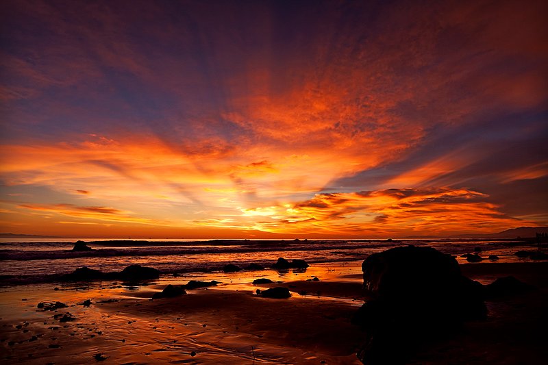 Ebb Tide Embers.jpg :: February 5th, 2011 brought an ebb tide and a magnificent sunset afterglow with bluish rays of light eminating from beyond the horizon at Carpinteria, California.