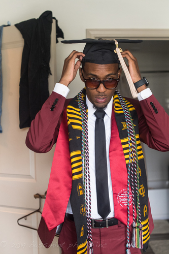 garrett putting on the cap.jpg