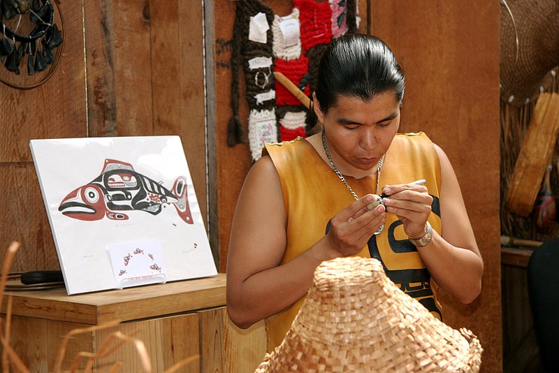 Artisan in Vancouver 2 Web.jpg :: British Columbia First Nations artisan works on small sculpture on the grounds of the Capilano Suspension Bridge in Vancouver, BC. The Capilano Suspension Bridge is Vancouver's oldest and best known tourist attraction. Shot August, 2005