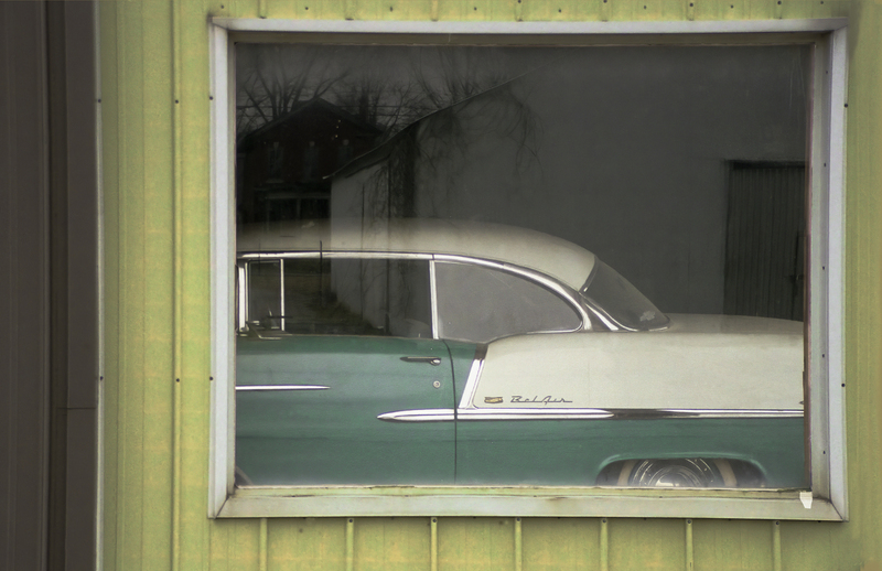 Relecting Memories FINAL.jpg :: This old car was seen in an old building while traveling through a very small town.  I was intrique by the reflection in the window, too.