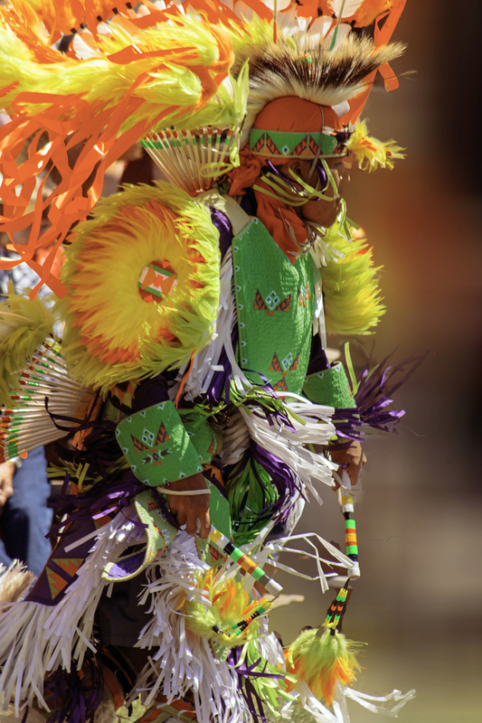 Teenaged Native American Boy in Brilliant Orange and Green Regalia FINAL .jpg :: Teenaged Native American boy in brilliant orange and green regalia at Pow Wow Regalia at Cheyenne Days in Wyoming 2010.
