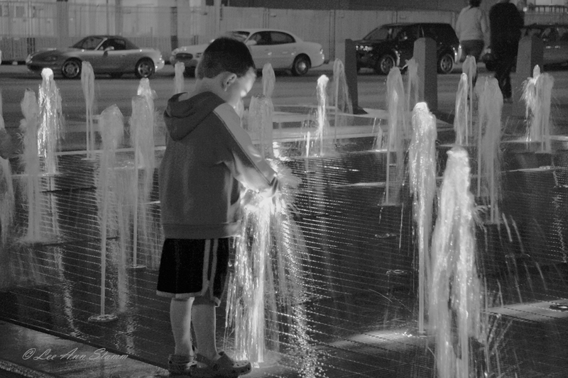 Boy In Fountain.jpg :: Boy Child Plays in Water Fountain at Waterfront Park, Louisville, Kentucky, USA, North America during Derby Days Festival, prior to 133rd running.  This was right across from the Hot Air Balloon Event called \