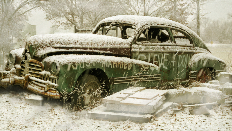 Happily Ever After.jpg :: This old car was outside a home in Harrisonville, Mo.  Owned by Gary A. Werner, 816-380-7247.  It was snowing big flakes the day I took this photo and the snow lay heavy upon the car.  However, bits and pieces of its history still showed through