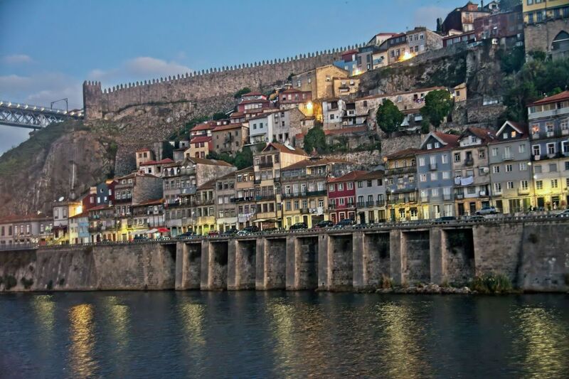 DC 22-0654-018.jpg :: Saga Douro River Cruise, Porto to Regua Lamego, River Douro: Early morning aboard the MS Douro Spirit departing Porto to Lamego. The steep banks of the Douro with the city walls above. Photo taken 30/08/2022