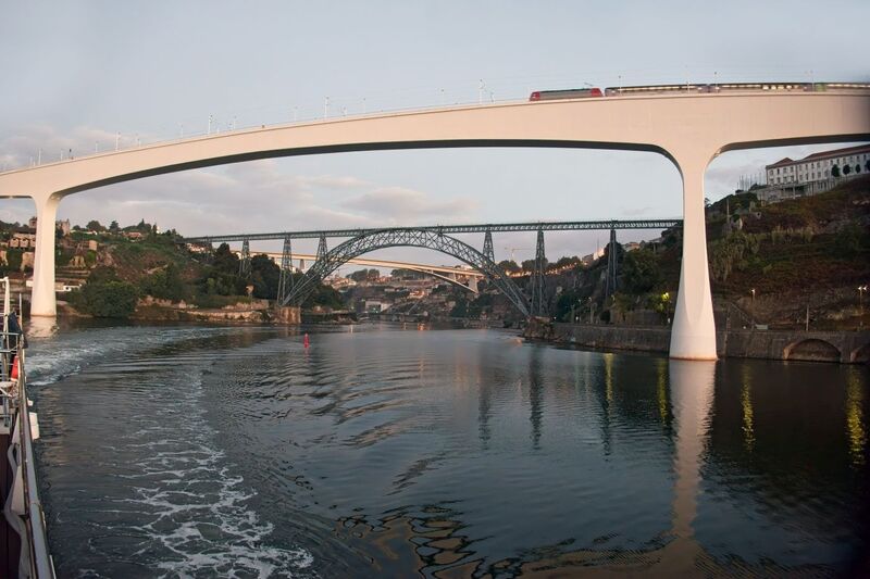 DC 22-0654-025.jpg :: Saga Douro River Cruise, Porto to Regua Lamego, River Douro: Early morning aboard the MS Douro Spirit departing Porto to Lamego. Ponte Infante Dom Henrique. The Infante Dom Henrique Bridge, also known as the Infante Bridge, is a road bridge that connects Vila Nova de Gaia to Porto, over the Douro River in Portugal. Named in honour of Infante D. Henrique, born in Porto, it is the most recent bridge connecting Porto and Gaia. It was built to replace the upper deck of the Luís I Bridge. Photo taken 30/08/2022