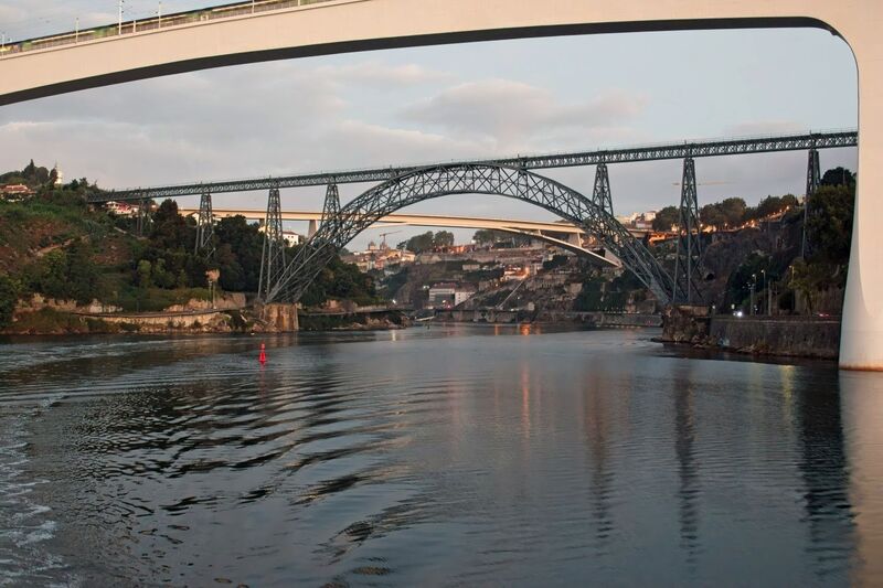 DC 22-0654-026.jpg :: Saga Douro River Cruise, Porto to Regua Lamego, River Douro: Early morning aboard the MS Douro Spirit departing Porto to Lamego. Ponte Infante Dom Henrique. The Infante Dom Henrique Bridge, also known as the Infante Bridge, is a road bridge that connects Vila Nova de Gaia to Porto, over the Douro River in Portugal. Named in honour of Infante D. Henrique, born in Porto, it is the most recent bridge connecting Porto and Gaia. It was built to replace the upper deck of the Luís I Bridge. Photo taken 30/08/2022