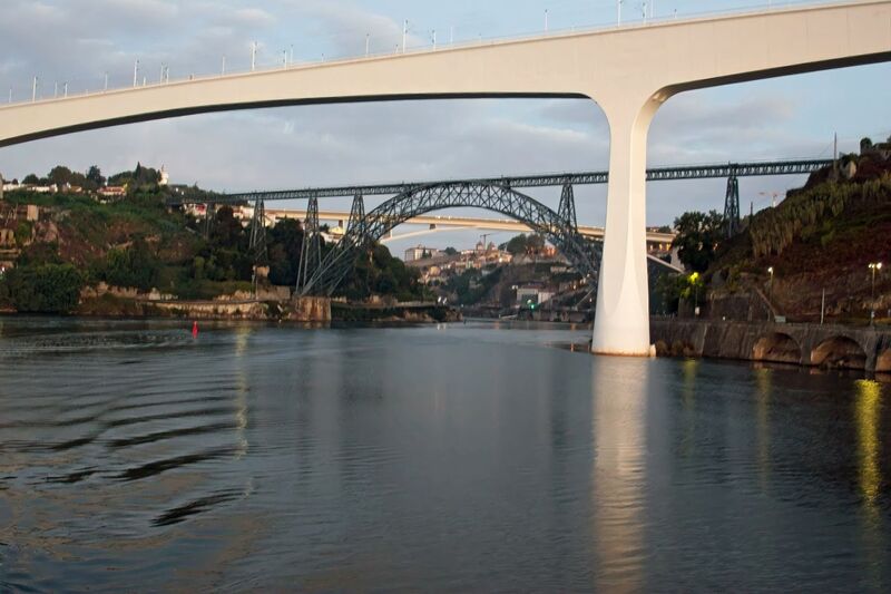 DC 22-0654-027.jpg :: Saga Douro River Cruise, Porto to Regua Lamego, River Douro: Early morning aboard the MS Douro Spirit departing Porto to Lamego. Ponte Infante Dom Henrique. The Infante Dom Henrique Bridge, also known as the Infante Bridge, is a road bridge that connects Vila Nova de Gaia to Porto, over the Douro River in Portugal. Named in honour of Infante D. Henrique, born in Porto, it is the most recent bridge connecting Porto and Gaia. It was built to replace the upper deck of the Luís I Bridge. Photo taken 30/08/2022