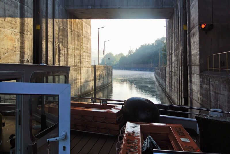 DC 22-0654-050a.jpg :: Saga Douro River Cruise, Porto to Regua Lamego, River Douro: Early morning aboard the MS Douro Spirit departing Porto to Lamego. Crestuma–Lever Dam is a concrete gravity dam on the Douro. It is located in the municipality Vila Nova de Gaia, in Porto District. Construction of the dam began in 1976. The dam was completed in 1985. It is owned by Companhia Portuguesa de Produção de Electricidade (CPPE). On the left side of the dam is a lock, which can handle ships with the following maximum properties: 83 m in length, 11.40 m on the beam, 3.8 m load-draught and a cargo capacity of 2500 tons. The MS Douro Spirit inside the lock. The MS Douro Spirit departing the lock. Photo taken 30/08/2022
