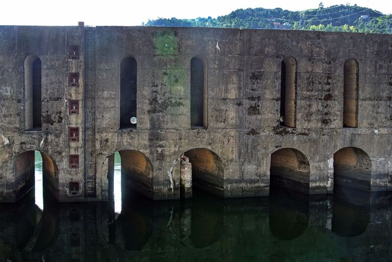 DC 22-0654-071.jpg :: Saga Douro River Cruise, Porto to Regua Lamego, River Douro: Early morning aboard the MS Douro Spirit departing Porto to Lamego. Carrapatelo Dam is a concrete gravity dam on the Douro, where the river forms the borderline between the districts of Porto and Viseu. It is located in the municipalities of Marco de Canaveses, in Porto District, and Cinfães, Viseu District, Portugal. Construction of the dam began in 1964. The dam was completed in 1972. It is owned by Companhia Portuguesa de Produção de Electricidade (CPPE). The MS Douro Spirit approaching the slipway leading into the lock. Photo taken 30/08/2022