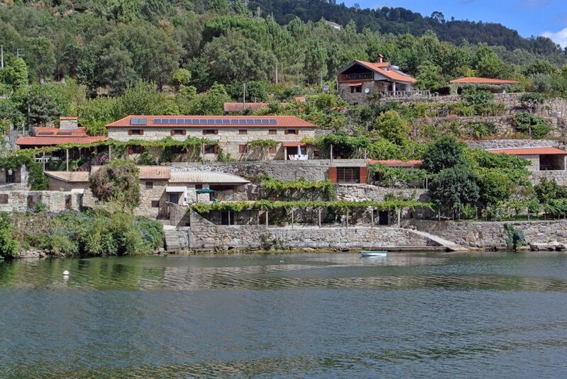 DC 22-0654-085.jpg :: Saga Douro River Cruise, Porto to Regua Lamego, River Douro: Early morning aboard the MS Douro Spirit departing Porto to Lamego. Embankment scenery, just pass the Carrapatelo Dam on route to Lamego in the Marco de Canaveses region. Photo taken 30/08/2022