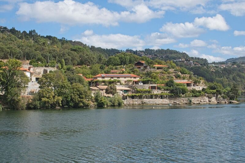 DC 22-0654-090.jpg :: Saga Douro River Cruise, Porto to Regua Lamego, River Douro: Early morning aboard the MS Douro Spirit departing Porto to Lamego. Embankment scenery, just pass the Carrapatelo Dam on route to Lamego in the Marco de Canaveses region. Photo taken 30/08/2022