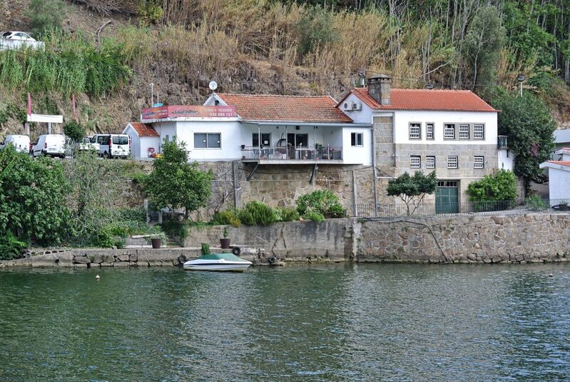 DC 22-0654-124.jpg :: Saga Douro River Cruise, Porto to Regua Lamego, River Douro: Early morning aboard the MS Douro Spirit departing Porto to Lamego. Embankment scenery on route to Lamego, passing Ribadouro just before Ponte de Mosteirô. Photo taken 30/08/2022