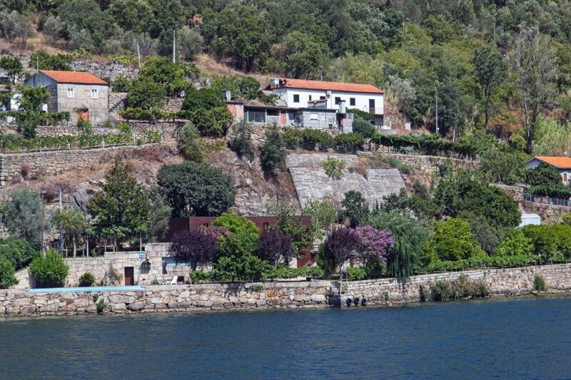 DC 22-0654-147.jpg :: Saga Douro River Cruise, Porto to Regua Lamego, River Douro: Afternoon aboard the MS Douro Spirit departing Porto to Lamego. Embankment scenery on route to Lamego, passing Caminho do Rio. Photo taken 30/08/2022
