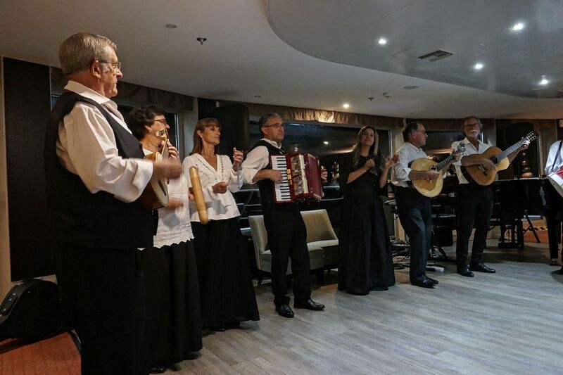 DC 22-0789-034.jpg :: Saga Douro River Cruise, Regua Lamego to Pinhao, River Douro: Fado musicians, known as fadistas, are performers of Fado, a traditional Portuguese music genre characterized by deep emotions and longing, or saudade. Photo taken 30/08/2022.