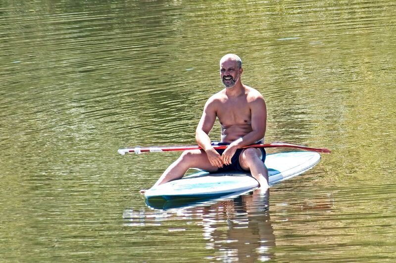 DC 22-0790-014.jpg :: Saga Douro River Cruise, Pinhao to Barca d'Alva: Cruising on board the MS Douro Spirit. Paddle boarder on route to Barca d'Alva. Photo taken 31/08/2022