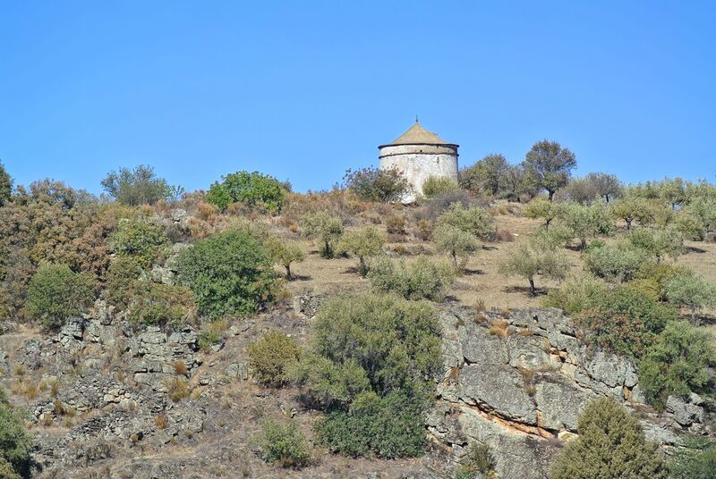 DC 22-0791-107.jpg :: Saga Douro River Cruise, Barca d'Alva,Sapinha:  Sapinha refers to the Miradouro Natural do Alto da Sapinha, a scenic viewpoint in Portugal offering views of the Douro River and its cliffs. It is a popular spot for its impressive, sweeping vistas, which are especially beautiful for birdwatching and visualizing the border between Portugal and Spain. The viewpoint is accessible by road, located near Figueira de Castelo Rodrigo, and is known for the breathtaking views it provides of the river valley. The image features a traditional dovecote, located in the historic village of Castelo Rodrigo. This type of structure, known as a pombais in Portuguese, was historically used for housing pigeons or doves. Photo taken 31/08/2022