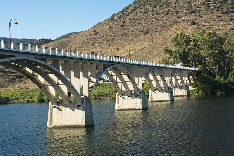 DC 22-0791-123.jpg :: Saga Douro River Cruise, Barca d'Alva:  The Almirante Sarmento Rodrigues Bridge, also known as the Highway Bridge of Barca d'Alva, is a road bridge over the Douro River, located near the village of Barca d'Alva in Portugal. It was designed by Edgar Cardoso, opened in 1955, and carries national route N221, connecting Portugal and Spain. It is the first highway bridge on the Portuguese section of the Douro River. Photo taken 31/08/2022