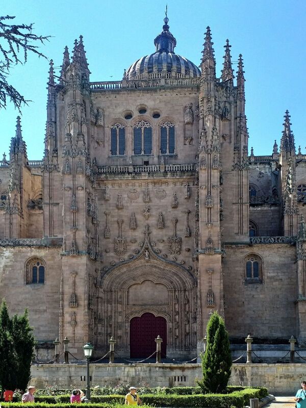 DC 22-0794-069.jpg :: Saga Douro River Cruise, Salamanca. Spain: The New Cathedral of Salamanca (Catedral Nueva), located in Salamanca, Spain. This architectural marvel is a blend of late Gothic, Plateresque, and Baroque styles. Construction took place between 1513 and 1733, making it one of the largest cathedrals in Spain. It is part of a unique complex where the New Cathedral is built alongside the older Romanesque-style Old Cathedral (Catedral Vieja). The cathedral is known for its impressive height, including a tower that stands at 92 meters, one of the tallest in Spain. A notable curiosity is the modern carving of an astronaut on one of the cathedral's doors, added during a 20th-century restoration. Photo taken 01/09/2022