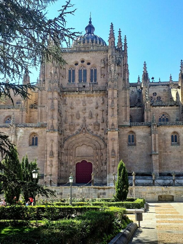 DC 22-0794-070.jpg :: Saga Douro River Cruise, Salamanca. Spain: The New Cathedral of Salamanca (Catedral Nueva), located in Salamanca, Spain. This architectural marvel is a blend of late Gothic, Plateresque, and Baroque styles. Construction took place between 1513 and 1733, making it one of the largest cathedrals in Spain. It is part of a unique complex where the New Cathedral is built alongside the older Romanesque-style Old Cathedral (Catedral Vieja). The cathedral is known for its impressive height, including a tower that stands at 92 meters, one of the tallest in Spain. A notable curiosity is the modern carving of an astronaut on one of the cathedral's doors, added during a 20th-century restoration. Photo taken 01/09/2022