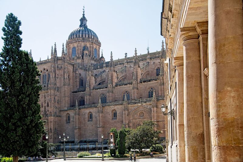 DC 22-0794-072.jpg :: Saga Douro River Cruise, Salamanca. Spain: The New Cathedral of Salamanca (Catedral Nueva), located in Salamanca, Spain. This architectural marvel is a blend of late Gothic, Plateresque, and Baroque styles. Construction took place between 1513 and 1733, making it one of the largest cathedrals in Spain. It is part of a unique complex where the New Cathedral is built alongside the older Romanesque-style Old Cathedral (Catedral Vieja). The cathedral is known for its impressive height, including a tower that stands at 92 meters, one of the tallest in Spain. A notable curiosity is the modern carving of an astronaut on one of the cathedral's doors, added during a 20th-century restoration. Photo taken 01/09/2022