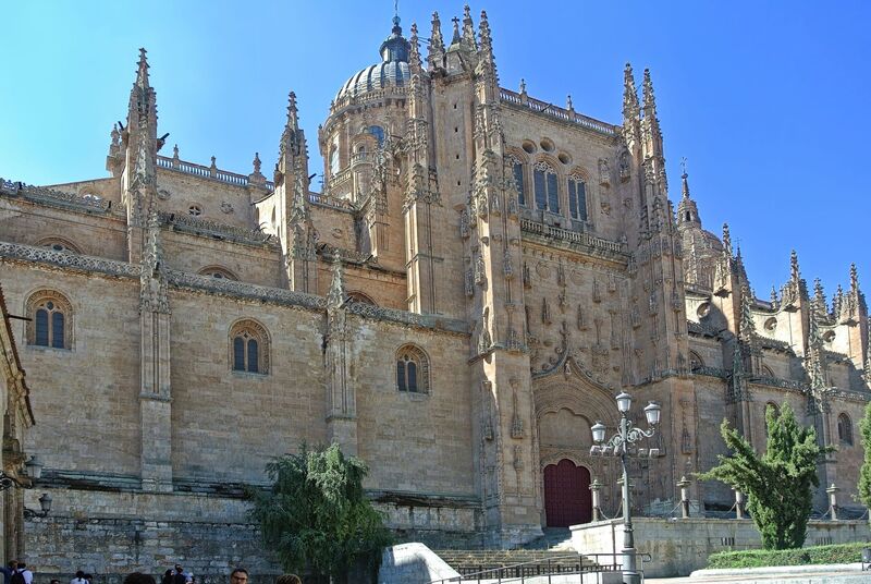 DC 22-0794-076.jpg :: Saga Douro River Cruise, Salamanca. Spain: The New Cathedral of Salamanca (Catedral Nueva), located in Salamanca, Spain. This architectural marvel is a blend of late Gothic, Plateresque, and Baroque styles. Construction took place between 1513 and 1733, making it one of the largest cathedrals in Spain. It is part of a unique complex where the New Cathedral is built alongside the older Romanesque-style Old Cathedral (Catedral Vieja). The cathedral is known for its impressive height, including a tower that stands at 92 meters, one of the tallest in Spain. A notable curiosity is the modern carving of an astronaut on one of the cathedral's doors, added during a 20th-century restoration. Photo taken 01/09/2022