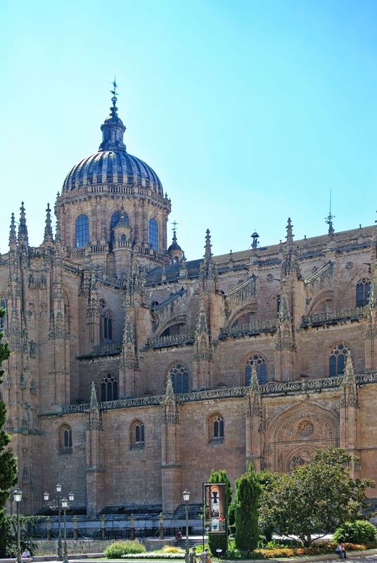 DC 22-0794-077.jpg :: Saga Douro River Cruise, Salamanca. Spain: The New Cathedral of Salamanca (Catedral Nueva), located in Salamanca, Spain. This architectural marvel is a blend of late Gothic, Plateresque, and Baroque styles. Construction took place between 1513 and 1733, making it one of the largest cathedrals in Spain. It is part of a unique complex where the New Cathedral is built alongside the older Romanesque-style Old Cathedral (Catedral Vieja). The cathedral is known for its impressive height, including a tower that stands at 92 meters, one of the tallest in Spain. A notable curiosity is the modern carving of an astronaut on one of the cathedral's doors, added during a 20th-century restoration. Photo taken 01/09/2022