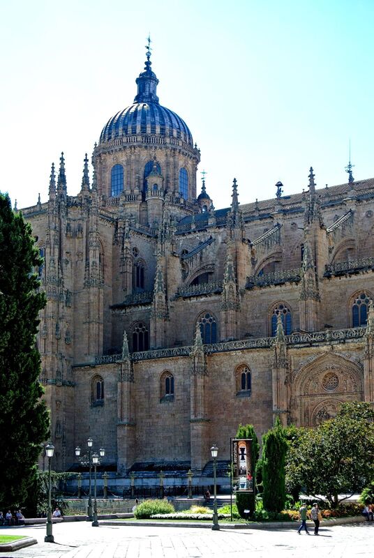 DC 22-0794-082.jpg :: Saga Douro River Cruise, Salamanca. Spain: The New Cathedral of Salamanca (Catedral Nueva), located in Salamanca, Spain. This architectural marvel is a blend of late Gothic, Plateresque, and Baroque styles. Construction took place between 1513 and 1733, making it one of the largest cathedrals in Spain. It is part of a unique complex where the New Cathedral is built alongside the older Romanesque-style Old Cathedral (Catedral Vieja). The cathedral is known for its impressive height, including a tower that stands at 92 meters, one of the tallest in Spain. A notable curiosity is the modern carving of an astronaut on one of the cathedral's doors, added during a 20th-century restoration. Photo taken 01/09/2022