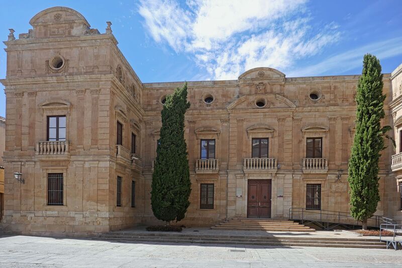 DC 22-0794-090.jpg :: Saga Douro River Cruise, Salamanca. Spain: The Palacio Episcopal de Salamanca (Episcopal Palace of Salamanca), which currently houses the Salamanca Museum of History and the Diocesan Museum of Sacred Art. It is located in Plaza Juan XXIII, near the city's cathedrals. The current structure was largely built between 1886 and 1889 in a classicist style by architect José Secall y Asión, on the site of an earlier medieval palace. The building incorporates elements from earlier periods and is part of the historic centre of Salamanca, a UNESCO World Heritage site. Historically, it served as the residence for the Bishops of Salamanca. Notably, during the Spanish Civil War, it was used as General Franco's residency and headquarters. Today, it is open to the public as a museum complex. Visitors can explore a collection of historic and contemporary artworks, including paintings by artists like Fernando Gallego, as well as church artifacts and antiquities. Photo taken 01/09/2022