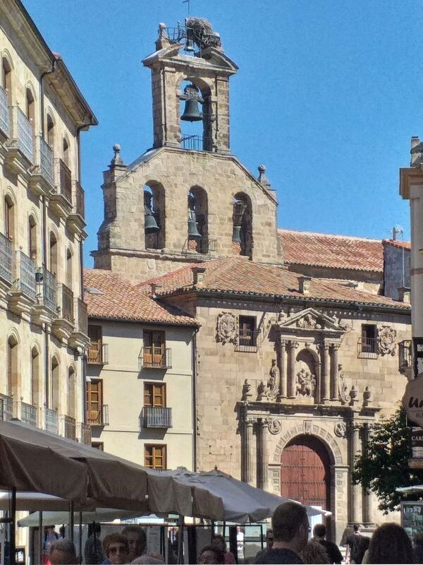 DC 22-0794-162a.jpg :: Saga Douro River Cruise, Salamanca. Spain: Iglesia de San Martín de Tours (Church of Saint Martin of Tours). This historic church, also referred to as San Martín Church, is a prominent landmark located near the Plaza Mayor. It is an example of Spanish Romanesque architecture. It was declared a National Historic-Artistic Monument (a Spanish asset of cultural interest) in 1931. The church was built in the 12th century, on top of a previous construction, during the city's resettlement. Photo taken 01/09/2022